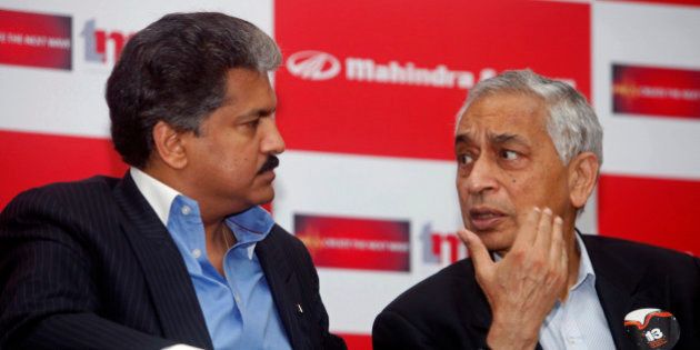 Mahindra Group Managing Director Anand Mahindra, left, and Tech Mahindra chief executive Vineet Nayyar talk during the announcement of the commencement of its special economic zone (SEZ) at the Mahindra Satyam infocity campus in Hyderabad, India, Tuesday, April 13, 2010. According to news reports, the SEZ is spread across 26 acres and have a built-up area of 400,000 square feet. The construction has already started. (AP Photo/Mahesh Kumar A)