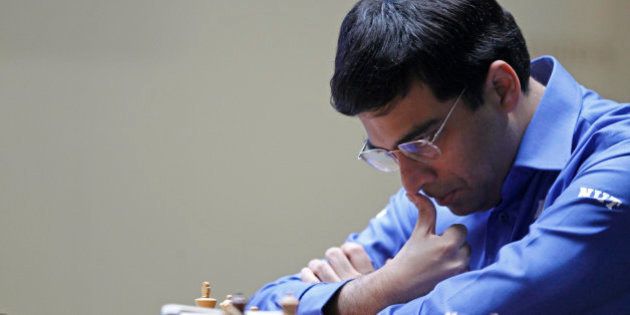 World Chess champion Viswanathan Anand from India, contemplates his next move during a match against Boris Gelfand of Israel at the FIDE World Chess Championship match at Moscow's Tretyakovsky State Gallery, Russia, Monday, May 28, 2012. (AP Photo/Misha Japaridze)