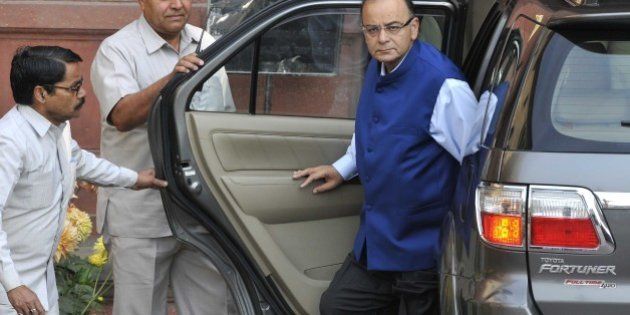 NEW DELHI, INDIA - FEBRUARY 28: Union Finance Minister Arun Jaitley arrives to presents the Budget 2015-16 in Parliament, that aims to ramp up growth, aided by a slowed pace of fiscal deficit cuts and a raft of tax measures to put private domestic and foreign capital to work, at North Block on February 28, 2015 in New Delhi, India. Jaitley promised higher investment in India's decrepit roads and railways, offered the carrot of corporate tax cuts to global corporations and the stick of tighter compliance rules to get Indian tycoons to invest at home rather than stash wealth abroad. He forecast inflation at 5% by the end of the fiscal year ending March 2016, undershooting the Reserve Bank of India's 6% target and creating room to cut interest rates. Annual inflation was 5.1% in January. He proposed to abolish the wealth tax and proposed two percent surcharge on the super rich. He said the government is proposing to rationalise various tax exemptions and incentives to reduce tax disputes and improve tax administration. (Photo by Mohd Zakir/Hindustan Times via Getty Images)