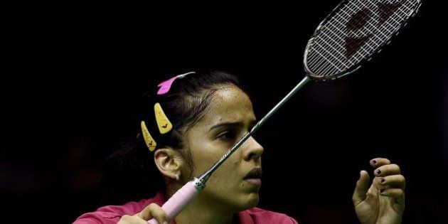 Saina Nehwal of India prepares to play a point against China's Li Xuerui during their women's singles semi-final match at the 2015 Malaysia Open Badminton Superseries in Kuala Lumpur on April 4, 2015. AFP PHOTO / MANAN VATSYAYANA (Photo credit should read MANAN VATSYAYANA/AFP/Getty Images)