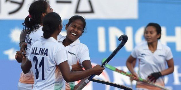 India's Vandana Kataria (L) celebrates a goal against Japan with Lilima Minz (2L) and teammates during their women's field hockey bronze medal match at the Seonhak Hockey Stadium during the 17th Asian Games in Incheon on October 1, 2014. AFP PHOTO / PRAKASH SINGH (Photo credit should read PRAKASH SINGH/AFP/Getty Images)