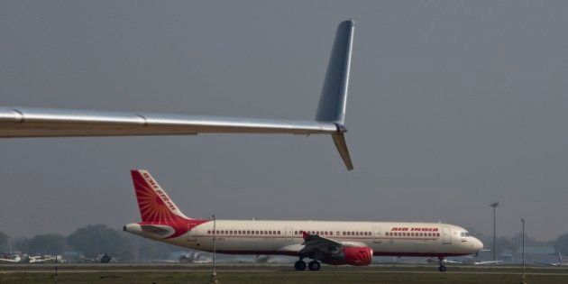 An Air India Airbus A321 taxis at Indira Gandhi international airport, in New Delhi, India,Wednesday, March 18, 2015. (AP Photo / Manish Swarup)