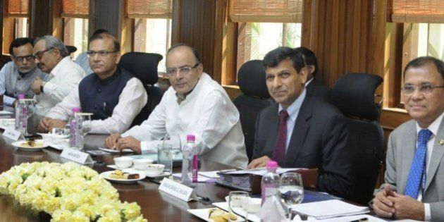 NEW DELHI, INDIA - MARCH 22: Union Minister for Finance, Corporate Affairs and Information & Broadcasting, Arun Jaitley, Minister of State for Finance, Jayant Sinha, Governor of Reserve Bank of India, Shri Raghuram Rajan and other dignitaries during the 550th Central Board meeting of RBI, on March 22, 2015 in New Delhi, India. Scotching murmurs of differences between the government and the RBI over regulation of money market, Jaitley said there is no 'disconnect' between the two and hoped banks would follow the central bank in reducing interest rates. (Photo by Sushil Kumar/Hindustan Times via Getty Images)