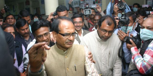 BHOPAL, INDIA - FEBRUARY 11: Madhya Pradesh Chief Minister Shivraj Singh Chouhan during his inspection of swine flu ward at JP hospital at district hospital on February 11, 2015 in Bhopal, India. As many as 216 people have lost their lives to Swine Flu across the country in the first ten days of February as the death toll due to the contagious disease mounted to 407 this year, mostly in states like Gujarat, Rajasthan and Madhya Pradesh. (Photo by Bidesh Manna/Hindustan Times via Getty Images)