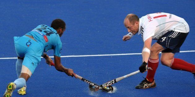 India's Vitalachharya Sunil Sowmarper (L) vies against Ben Hawes of Britain during a third place play-off match at the Sultan Azlan Shah Cup men's field hockey tournament in Malaysia's nothern town Ipoh of Perak state on June 3, 2012. India beat Britain 3-1. AFP PHOTO / Saeed Khan (Photo credit should read SAEED KHAN/AFP/GettyImages)