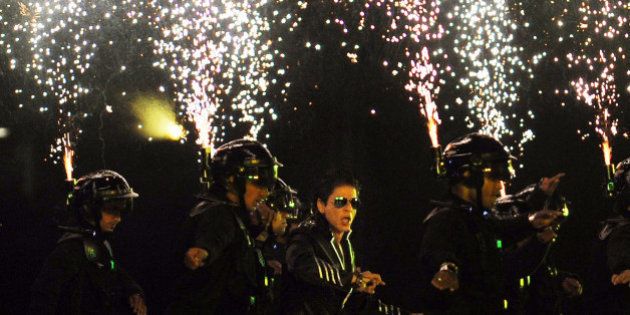 RESTRICTED TO EDITORIAL USE. MOBILE USE WITHIN NEWS PACKAGEBollywood actor Shah Rukh Khan (C) performs during the opening ceremony of the Indian Premier League (IPL) Twenty20 at The M.A. Chidambaram Stadium in Chennai on April 8, 2011. Defending champion Chennai Super Kings will face the chalenge of Kolkata Knight Riders in the first match of the tournament. AFP PHOTO/ Dibyangshu SARKAR (Photo credit should read DIBYANGSHU SARKAR/AFP/Getty Images)