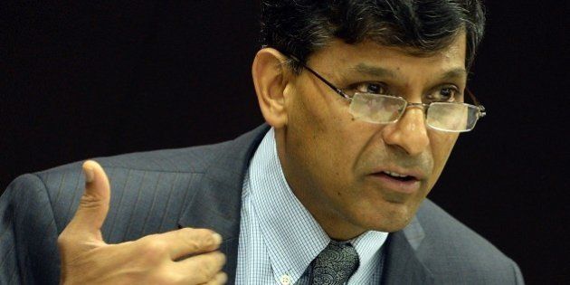 Reserve Bank of India (RBI) governor Raghuram Rajan attends a news conference after the announcement of the first bi-monthly monetary policy for year 2015-16 at the RBI headquarters in Mumbai on April 7, 2015. India's central bank kept interest rates on hold April 7, saying most commercial lenders have yet to pass on two previous cuts to customers in Asia's third largest economy. AFP PHOTO/PUNIT PARANJPE (Photo credit should read PUNIT PARANJPE/AFP/Getty Images)