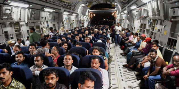 Indians evacuated from Yemen sit inside the Indian Air Force C17 Globemaster aircraft upon their arrival at Chhatrapati Shivaji International Airport in Mumbai, India, Thursday, April 2, 2015. India is evacuating its citizens from Yemen amid the growing violence in the Middle Eastern country. (AP Photo/Press Trust of India, Mitesh Bhuvad)