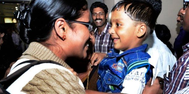 In this Saturday, April 4, 2015 photo, Indian nurse Tinu, left, one among the Indians evacuated from Yemen meets her son Febin upon her arrival in Kochi, India. India is evacuating its citizens from Yemen amid the growing violence in the Middle Eastern country. (AP Photo)