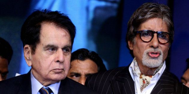 Indian Bollywood actors Amitabh Bachchan (R) and Dilip Kumar (L) attend the â143rd Dadasaheb Phalke Academy Awards 2012â ceremony, celebrating Indian Cinema in Mumbai on 3 May, 2012. AFP PHOTO/ STR (Photo credit should read STRDEL/AFP/GettyImages)