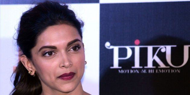 Indian Bollywood actress Deepika Padukone looks on during a promotional event for the forthcoming Hindi film 'Piku' directed by Shoojit Sircar in Mumbai on late March 25, 2015. AFP PHOTO / STR (Photo credit should read STRDEL/AFP/Getty Images)