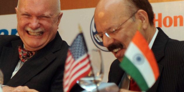 Director General of Indian Civil Aviation, Nasim Zaidi (R) talks with the US Ambassador to India, Peter Burleigh, during US-India Aviation Summit in New Delhi on November 17, 2011. India and US signed two Aviation Safety Agreements between the US Federal Aviation Administration and India's Directorate General of Civil Aviation. AFP PHOTO/RAVEENDRAN (Photo credit should read RAVEENDRAN/AFP/Getty Images)