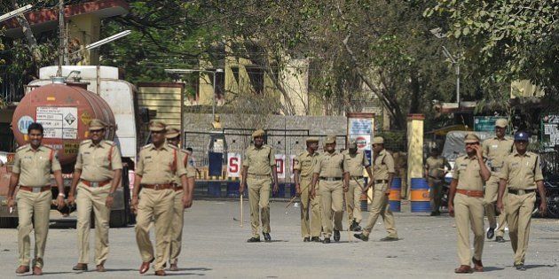 Indian police personnel patrol at the entrance to Gulf Oil Corporation Limited company (Explosives Division) in Hyderabad on February 24, 2015, following an explosion at the site. An explosion at lubricants maker Gulf Oil Corp's unit in southern India killed two people and injured at least 13 others late February 23, police said. Police said the explosion at Gulf Oil, which sells lubricants and industrial explosives in India and overseas, took place after detonators were being disposed of at its office located in the southern Indian city of Hyderabad in Andhra Pradesh state. AFP PHOTO / Noah SEELAM (Photo credit should read NOAH SEELAM/AFP/Getty Images)