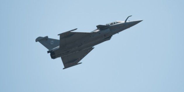 A French navy Rafale fighter jet performs during the Langkawi International Maritime and Aerospace Exhibition 2015 (LIMA15) in Malaysia's resort island of Langkawi on March 18, 2015. Lima'15 is the premier destination for aerospace and maritime manufacturers targeting the Asia Pacific growth markets from the defence, enforcement, civil and commercial sectors. AFP PHOTO / MOHD RASFAN (Photo credit should read MOHD RASFAN/AFP/Getty Images)