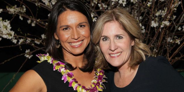 WASHINGTON, DC - MARCH 18: Rep. Tulsi Gabbard and Elizabeth Thorp attend the ELLE and HUGO BOSS Women in Washington Power List Dinner at The Residence of the German Ambassador on March 18, 2015 in Washington, DC. (Photo by Paul Morigi/Getty Images for ELLE)