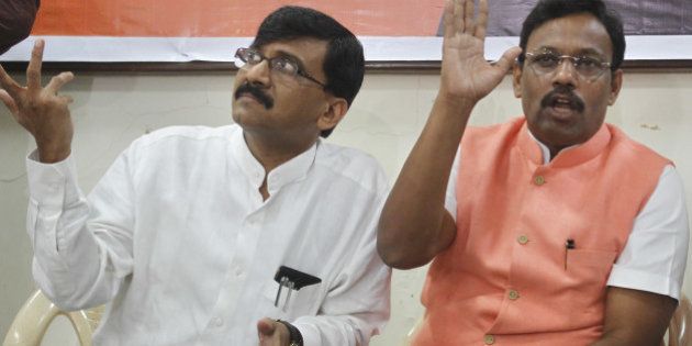 MUMBAI, INDIA - SEPTEMBER 23: (R- L) BJP Leader Vinod Tawde and Shiv Sena spokesman Sanjay Raut addressing press after the BJP-Sena executive committee meeting at Dadar on September 23, 2014 in Mumbai, India. Both parties said that they were firm on continuing the alliance as they resumed the deadlocked seat-sharing talks for Maharashtra Assembly polls. (Photo by Satish Bate/Hindustan Times via Getty Images)