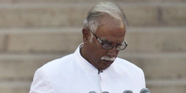 In this photograph taken on May 26, 2014, Telugu Desam Party (TDP) MP Ashok Gajapathi Raju takes the oath of office during a swearing-in ceremony for new Indian Prime Minister Narendra Modi and his council of ministers in New Delhi. India's Prime Minister Narendra Modi was expected to hold landmark talks with his Pakistani counterpart and announce his new cabinet May 27 as he looked to hit the ground running on his first day in office. AFP PHOTO/Prakash SINGH (Photo credit should read PRAKASH SINGH/AFP/Getty Images)