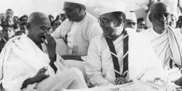 Members of the Indian National Congress (foreground left to right) Mahatma Gandhi (Mohandas Karamchand Gandhi, 1869 - 1948), Subhas Chandra Bose (1897 - 1945) and Vallabhai Patel (1875-1950) during the 51st Indian National Congress. (Photo by Keystone/Getty Images)