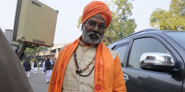 NEW DELHI, INDIA - DECEMBER 16: BJP MP Sakshi Maharaj after attending Parliament Board Meeting at Library Hall on December 16, 2014 in New Delhi, India. Lok Sabha passed a bill to regularise unauthorized colonies and rehabilitate slum dwellers in poll-bound Delhi.( Photo by Sonu Mehta/Hindustan Times via Getty Images)