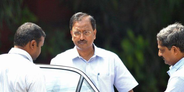 Indian former chairman of outsourcing giant Satyam, B. Ramalinga Raju (C), arrives to attend the final judgement of a fraud case against him and nine others at the Metropolitan Criminal Courts in Hyderabad on April 9, 2015. An Indian court on April 9, 2015, sentenced the former chief of outsourcing giant Satyam to seven years in jail over a $2.25 billion accounting fraud scandal dubbed 'India's Enron'. Byrraju Ramalinga Raju, his brother and eight others were found guilty of manipulating Satyam's books in a 2009 case that shook the industry and raised questions about the country's regulators. AFP PHOTO/ Noah SEELAM (Photo credit should read NOAH SEELAM/AFP/Getty Images)