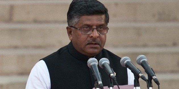 In this photograph taken on May 26, 2014, Bharatiya Janata Party (BJP) leader Ravi Shankar Prasad takes the oath of office during a swearing-in ceremony for new Indian Prime Minister Narendra Modi and his council of ministers in New Delhi. India's Prime Minister Narendra Modi was expected to hold landmark talks with his Pakistani counterpart and announce his new cabinet May 27 as he looked to hit the ground running on his first day in office. AFP PHOTO/Prakash SINGH (Photo credit should read PRAKASH SINGH/AFP/Getty Images)