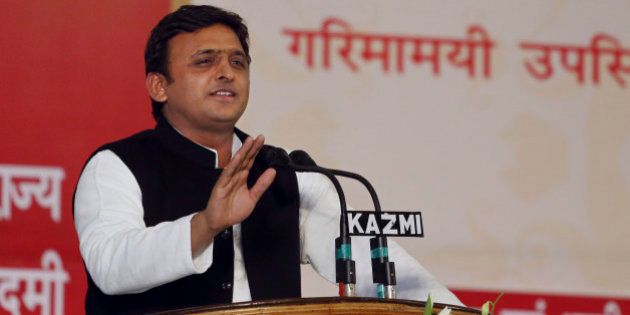 Uttar Pradesh state chief minister Akhilesh Yadav addresses a gathering in Lucknow, India, Tuesday, Feb. 25, 2014. Yadav inaugurated 17 projects and laid the foundation stone of 26 others. He also distributed loan waiver certificates to 7,017 farmers, according to local reports. (AP Photo/Rajesh Kumar Singh)
