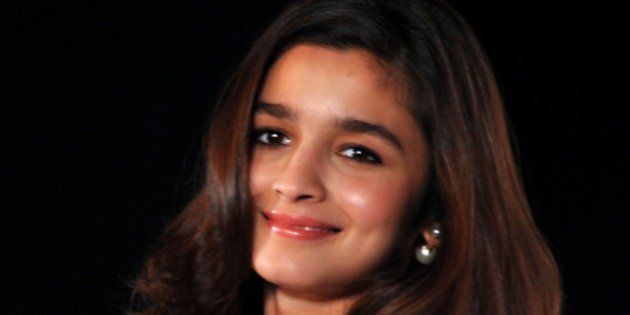 Indian Bollywood actress Alia Bhatt poses for a photograph during a promotional event in Mumbai on late August 11, 2014. AFP PHOTO/STR (Photo credit should read STRDEL/AFP/Getty Images)