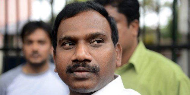 Former telecom minister A. Raja gesture as he interacts with the media following his appearance in connection with the 2G spectrum scam at the CBI court in New Delhi on May 5, 2014. The former telecom minister A Raja was jailed for over 15 months after being arrested in February 2011 for his role in the 2G spectrum scam case. AFP PHOTO/ Chandan KHANNA (Photo credit should read Chandan Khanna/AFP/Getty Images)