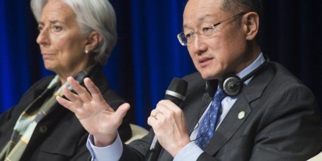 World Bank Group President Jim Yong Kim (R) speaks as International Monetary Fund (IMF) Managing Director Christine Lagarde looks on during the 2015 Global Parliamentary Conference at World Bank Headquarters in Washington, DC on April 13, 2015. The International Monetary Fund updated its forecasts on growth in the global economy ahead of the IMF and World Bank spring meetings this week. AFP PHOTO/ SAUL LOEB (Photo credit should read SAUL LOEB/AFP/Getty Images)