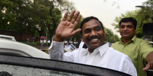 Former telecom minister A. Raja gestures as he leaves after he appeared in connection with the 2G spectrum scam at the CBI court in New Delhi on May 5, 2014. The former telecom minister A Raja was jailed for over 15 months after being arrested in February 2011 for his role in the 2G spectrum scam case. AFP PHOTO/ Chandan KHANNA (Photo credit should read Chandan Khanna/AFP/Getty Images)