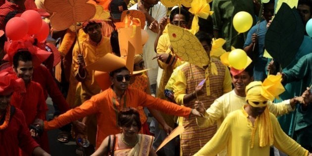 Bangladeshi revellers march during a rally in celebration of the Bengali New Year, or Pohela Boishakh,...