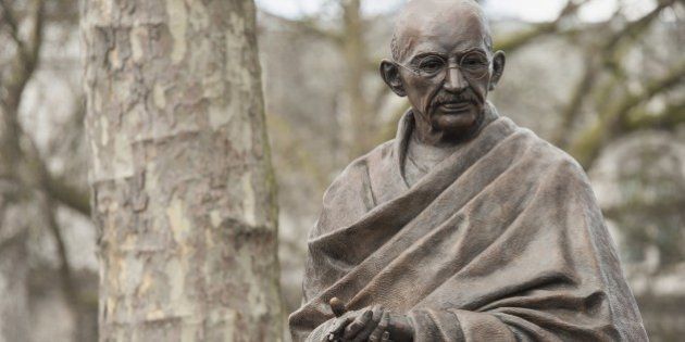 A recently unveiled statue of Mahatma Gandhi is seen in Parliament square in central London on March 14, 2015. A statue of Indian independence leader Mahatma Gandhi was unveiled on Saturday at the symbolic heart of the British establishment that once loathed him for his campaign against imperial rule. Gandhi joins figures including Britain's World War II leader Winston Churchill, who described him as a half-naked 'fakir', in London's Parliament Square, opposite Big Ben and the House of Commons. AFP PHOTO / NIKLAS HALLE'N (Photo credit should read NIKLAS HALLE'N/AFP/Getty Images)
