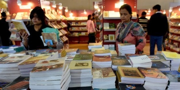 Indian visitors browse at a stall at the World Book Fair in New Delhi on February 16, 2015. TheÂ New Delhi World Book Fair (NDWBF) is organised by the National Book Trust of India and runs from 14 - 22 February, 2015. AFP PHOTO / MONEY SHARMA (Photo credit should read MONEY SHARMA/AFP/Getty Images)