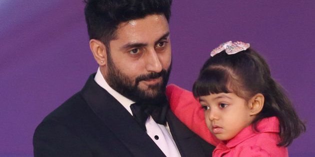 Abhishek Bachchan and daughter Aaradhya Bachchan, during the Miss World 2014 final, on stage at the Excel centre in east London, Sunday, Dec. 14, 2014. (Photo by Joel Ryan/Invision/AP)