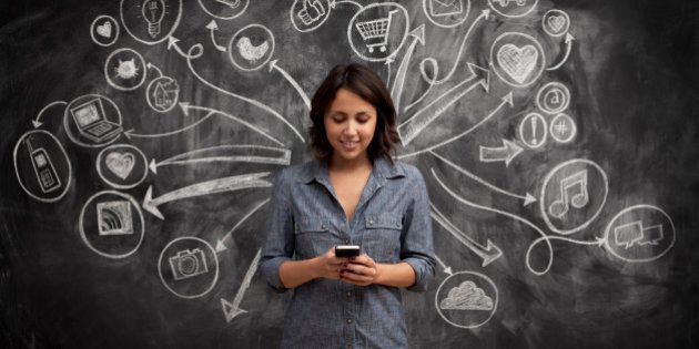Girl on phone with social media chalkboard