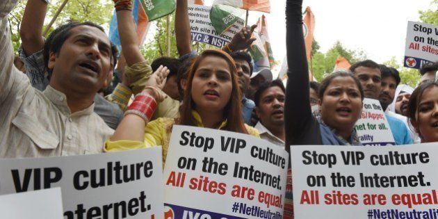 Activists of Indian Youth Congress and National Students Union of India shout anti-government slogans as they protest in support of net neutrality in New Delhi on April 16, 2015. India's largest e-commerce portal Flipkart on April 14 scrapped plans to offer free access to its app after getting caught up in a growing row over net neutrality, with the criticism of Flipkart feeding into a broader debate on whether Internet service providers should be allowed to favour one online service over another for commercial or other reasons -- a concept known as 'net neutrality'. AFP PHOTO / MONEY SHARMA (Photo credit should read MONEY SHARMA/AFP/Getty Images)