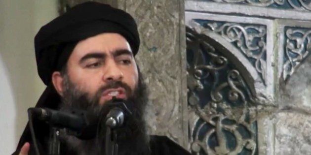 FILE - This file image made from video posted on a militant website Saturday, July 5, 2014, which has been authenticated based on its contents and other AP reporting, purports to show the leader of the Islamic State group, Abu Bakr al-Baghdadi, delivering a sermon at a mosque in Iraq. The leader of the Islamic State group said it will fight to the last man, in a strident audio recording released on social media networks Thursday, Nov. 13, that was his first public statement since a U.S.-led alliance launched airstrikes against his fighters in Iraq and Syria. (AP Photo/Militant video, File)
