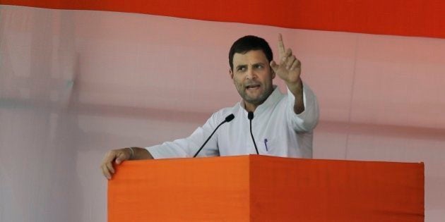 India's opposition Congress party vice president Rahul Gandhi addresses farmers during a rally against land bill in New Delhi, India, Sunday, April 19, 2015. Tens of thousands of flag-waving farmers rallied in India's capital on Sunday to protest the government's plan to ease rules for obtaining land for industry and development projects.(AP Photo/Altaf Qadri)