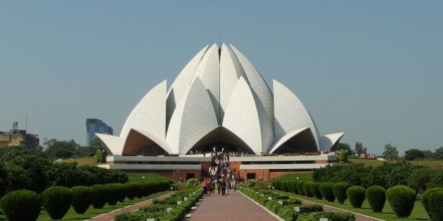 DELHI, INDIA - SEPTEMBER 30: Tourists visit the The BahÃ¡'i House of Worship known as the 'Lotus Temple' ahead of the Delhi 2010 Commonwealth Games on September 30, 2010 in Delhi, India. (Photo by Cameron Spencer/Getty Images)