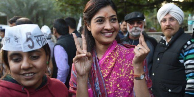 Senior Leader of India's Aam Aadmi Party (AAP) Alka Lamba (C) gestures as she arrives for a meeting in New Delhi on February 10, 2015. India's Narendra Modi suffered his first major election setback since becoming prime minister last May, as anti-corruption campaigner Arvind Kejriwal won a landslide victory in Delhi state polls. AFP PHOTO / SAJJAD HUSSAIN (Photo credit should read SAJJAD HUSSAIN/AFP/Getty Images)