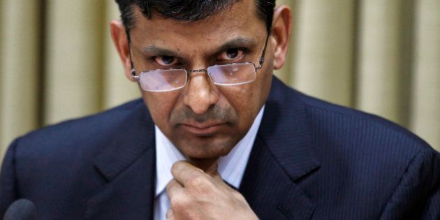 FILE - In this Wednesday, Sept. 4, 2013 file photo, newly appointed Governor of the Reserve Bank of India (RBI) Raghuram Rajan attends a press conference at the RBI headquarters in Mumbai, India. Rajan leads his first monetary policy review Friday as the country looks to the respected former IMF chief economist to rescue Asia's third-largest economy from slow growth, high inflation and a weakened currency. (AP Photo/Rajanish Kakade)