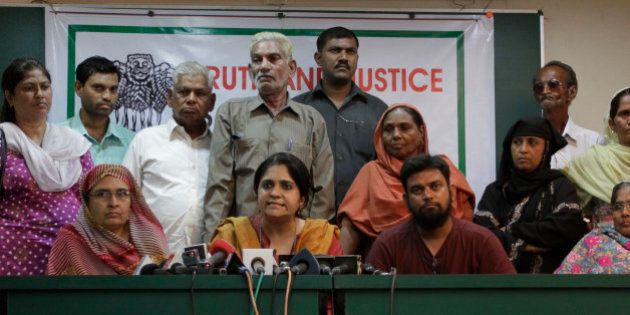 Citizens for Justice and Peace (CJP) founder Teesta Setalvad, center, addresses a press conference as riot victims look on during the release of selected tapes of a sting operation in Ahmadabad, India, Monday, March 22, 2010. The sting operation allegedly shows the direct and indirect role of Gujarat state Chief Minister Narendra Modi in the 2002 unrest between Hindus and Muslims that killed more than 1,000 people. CJP is a private group working with riot victims. (AP Photo/Ajit Solanki)