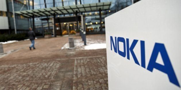 FILE - This Thursday, Jan. 29, 2015 shows the Nokia head offices in Espoo, Finland. Nokia says it is in advanced discussions to acquire the French telecommunications company Alcatel-Lucent. In a brief statement Tuesday, the Helsinki-based mobile technology concern said the two companies are in advanced negotiations