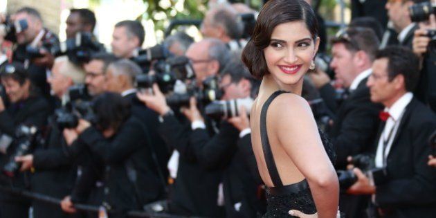 Indian actress Sonam Kapoor poses as she arrives for the screening of the film 'The Homesman' at the 67th edition of the Cannes Film Festival in Cannes, southern France, on May 18, 2014. AFP PHOTO / LOIC VENANCE (Photo credit should read LOIC VENANCE/AFP/Getty Images)
