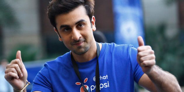 Indian Bollywood actor Ranbir Kapoor displays thumbs-up sign during a promotional event of soft drink major PepsiCo in Bangalore, India, Wednesday, Feb. 12, 2014. (AP Photo/Aijaz Rahi)