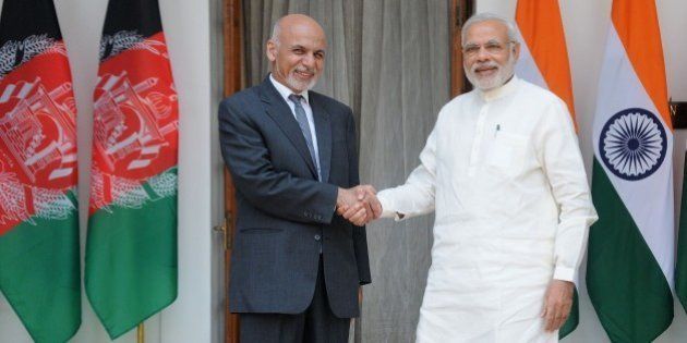 Afghan President Ashraf Ghani (L) shakes hands with Indian Prime Minister Narendra Modi in New Delhi on April 28, 2015. Ghani is on a three day visit to India. AFP PHOTO/STR (Photo credit should read STRDEL/AFP/Getty Images)