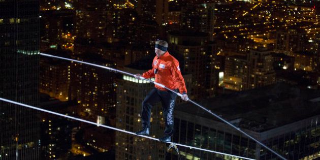 IMAGE DISTRIBUTED FOR DISCOVERY COMMUNICATIONS - Nik Wallenda walks over the Chicago River uphill nearly 8 stories for Discovery Channel's Skyscraper Live with Nik Wallenda on Sunday, Nov. 2, 2014. (Jean-Marc Giboux/AP Images for Discovery Communications)