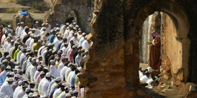 Indian Muslims offer Eid-al-Adha prayers among the ruins of the Feroz Shah Kotla mosque in New Delhi on October 6, 2014. Muslims across the world are preparing to celebrate the annual festival of Eid al-Adha, or the Festival of Sacrifice, which marks the end of the Hajj pilgrimage to Mecca and in commemoration of Prophet Abraham's readiness to sacrifice his son to show obedience to God. AFP PHOTO / CHANDAN KHANNA (Photo credit should read Chandan Khanna/AFP/Getty Images)