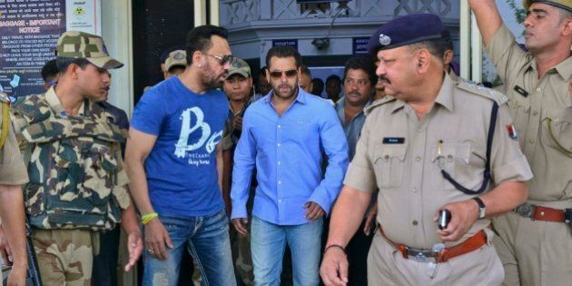 Bollywood actor Salman Khan, center, arrives at the Jodhpur civil airport to appear before a court in Jodhpur, Rajasthan, India, Wednesday, April 29, 2015. Khan and a few other Bollywood stars were accused of poaching blackbucks during the filming of a Hindi movie in 1998. (AP Photo/Mohammed Sharif)