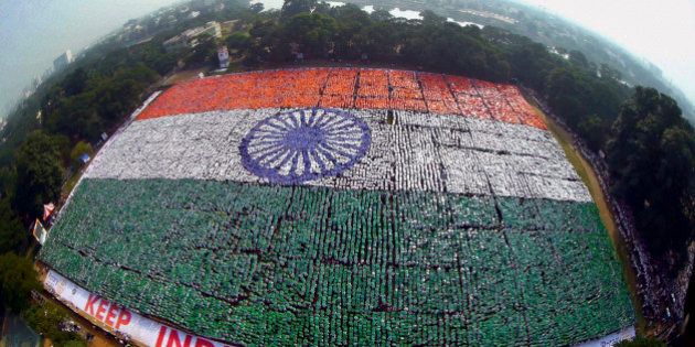 In this Sunday, Dec. 7, 2014 photo, an aerial picture shows the Indian national flag formed by volunteers seeking to set a Guinness Record for the largest human flag formation at Nandanam YMCA ground in Chennai, India. (AP Photo/Press Trust of India) INDIA OUT
